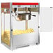 A Paragon popcorn machine with red and white stripes on it and popcorn in the container.