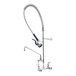 A T&S wall mount pet grooming faucet with a hose and sprayer.