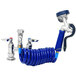 A blue coiled hose attached to a metal deck mount faucet.