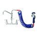 A T&S wall mount pet grooming faucet with a blue coiled hose and blue handle.