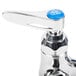 A T&S chrome pet grooming faucet with blue accents.