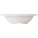 A Carlisle bone melamine fruit bowl with a rim.