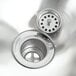 A stainless steel Eagle Group hand sink with a basket drain on a counter.