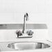 A stainless steel Eagle Group hand sink with a gooseneck faucet.