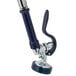 A T&S metal pet grooming faucet with a handle and hose.