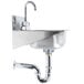 A close-up of a stainless steel Eagle Group hand sink with a faucet and drain basket.