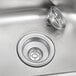 A stainless steel Eagle Group hand sink with a basket drain and tail piece.