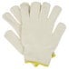 A pair of white Cordova jersey gloves with yellow trim.