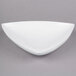 A white triangle shaped Tablecraft display bowl.