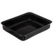 A black rectangular Carlisle deli crock tray on a counter.