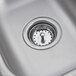 A close-up of a stainless steel Eagle Group sink bowl with a drain.