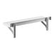 A white Cambro Camshelving® wall shelf with two metal brackets.