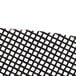 A black Scrubble sand screen disc with a black grid of white squares.
