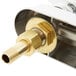 A close up of a metal object with a brass pipe.