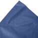 A navy blue plastic table skirt in packaging with a folded edge.