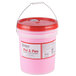 a pink container with a red lid