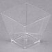 A clear plastic square bowl.