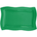 A green rectangular Tablecraft platter with wavy edges.