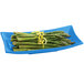 A Tablecraft sky blue cast aluminum rectangle platter with asparagus and lemon zest.