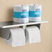 Two Lavex standard toilet paper rolls on a shelf.