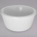 A white Carlisle fluted melamine ramekin.