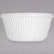 A white Carlisle fluted melamine ramekin.