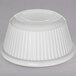 A white fluted melamine ramekin with a white background.