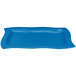 A sky blue rectangular cast aluminum serving platter with a wavy design.