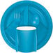 A turquoise blue rectangular table cover with white circles.