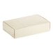 A 7 1/4" x 4 5/8" x 1 3/4" gold linen candy box with a lid.