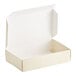 A white box with a white lid open.