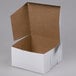 a white box with a brown lid