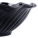 A black GET dessert dish with a wavy edge.