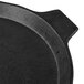 A black Tablecraft cast aluminum pizza tray with a handle.