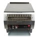 A close up of a Hatco stainless steel conveyor toaster with a metal rack on top.