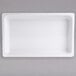 A white rectangular melamine food pan.