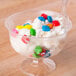 a bowl of ice cream with candy