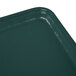 A teal rectangular Cambro tray on a counter.