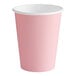 A Classic Pink paper hot cup with a white rim.