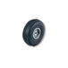 A black wheel with a metal rim and a black tire on a white Harper hand truck.