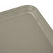 A close up of a rectangular taupe Cambro cafeteria tray.