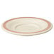 A white melamine saucer with red trim.