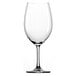 A close-up of a clear Stolzle wine glass with a stem.