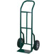 A green metal Harper hand truck with black wheels.