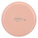 A pink Cambro fiberglass tray with a dark peach label.