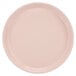A close-up of a light peach Cambro cafeteria tray.