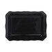 A black rectangular melamine dish with a scalloped edge.