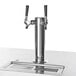 A stainless steel Beverage-Air beer tap with black handles on a counter.