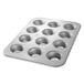 A Chicago Metallic muffin pan with twelve cupcake holes.