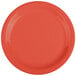 A close-up of a red GET Diamond Mardi Gras melamine plate.